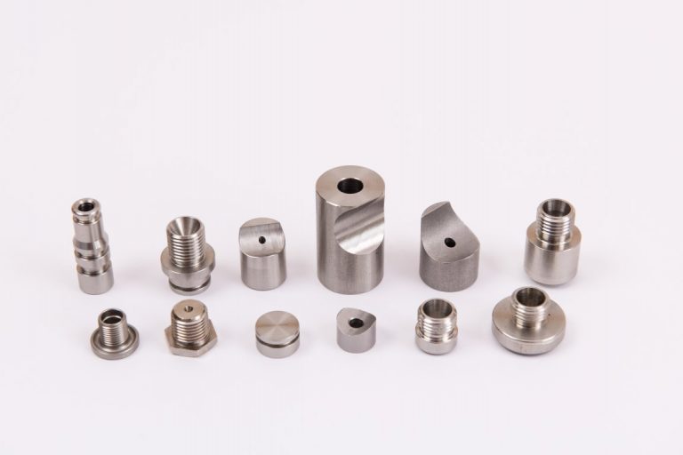 Machined sensor housings and electrical contact components